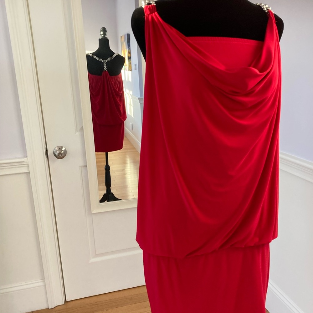 Red cocktail dress with silver beaded straps.